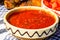 Close up of traditional rustic bowl with homemade tomatoes sauce