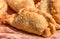 Close up of traditional Spanish and Argentine empanadas at a street food market.