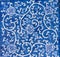 close up of traditional Tobeyaki multi tones blue ceramic tile with floral patterns background