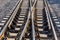 Close up of train or railroad tracks with cement backing In the countryside