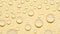 Close-up transparent water drops texture rotating on golden abstract background