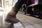 Close up of traveler feet step up to a passing train