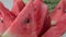 Close up of triangular slices of ripe watermelon with red flesh