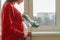 Close up tummy of pregnant woman with exotic green leaf