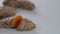 Close-Up of Turmeric Rhizome Cutting, Isolated on White Background: Golden Essence, rhizome (root) cutting