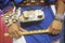 Close-up of turtle shell worn on the waist of a man holding flute during Corn Dance ceremony in Santa Clara Pueblo, NM