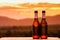 Close up of two beer bottles. mountain background