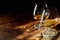 Close up of two bourbon filled glasses on table