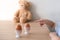 Close-up of two brown eggs on table, baby`s hands show, count, small child counting on fingers, happy childhood and school concep