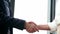 Close up of two businesswoman shaking hands