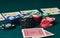 Close-up of two cards face down on the green mat to the right of the image to leave room for editing, other cards and poker chips