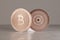 Close up of two copper bitcoins with focus on foreground as example for financial technology and online banking