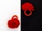 Close up two Crochet red rose flower scrunchy on modern bicolor black and white background, creative hand made concept