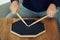 Close up of two drumming sticks on a practice pad at home