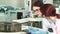 Close up of two female biologists making notes while conducting experiments