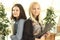 Close up.two female employees with a clipboard standing in the office