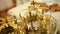 Close up of two gold wedding crowns prepared for ceremony of marriage in a church.