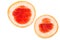 Close-up two halves of a delicious grapefruit isolated over the white background.
