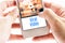 Close up Two hand holding smart phone with Viral Video word and