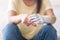 Close up two hands of woman with disability bionic arm, person lost her arm, disabled cyborg girl artificial prosthetic