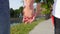 Close up of two lovers joining hands. Detail silhouette of man and woman holding hands and walking in the park. Couple