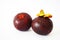 Close-up of two mangosteens in the white background