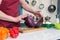 Close up of two part of red cabbage on table. Cook hold of two parts of red cabbage. Closeup of two parts of cabbage