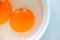 Close up two raw egg yolks