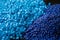 Close up of a two stacks of blue plastic polypropylene granules on a table,Generative AI