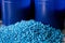 Close up of a two stacks of blue plastic polypropylene granules on a table,Generative AI