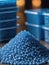 Close Up Of A Two Stacks Of Blue Plastic Polypropylene Granules On A Table. Generative AI