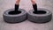 Close-up, in two tires jumping female athletic feet, slow motion