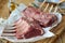 Close up on two trimmed seasoned racks of lamb