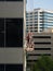 Close Up of Two Window Washers on a Suspended Scaffold Photographed at Eye Level