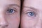 Close up two young girl eyes, they are looking at the camera, couple portrait children, macro