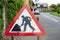 Close-up of a typical Roadworks sign seen located on a pavement area