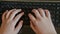 Close-up of typing female hands on keyboard