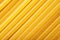 Close-up uncooked durum wheat spaghetti background
