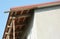 Close up on unfinished house roof soffit boards installation