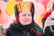 Close up of unknown beautiful aged woman in national folk clothes at Celebration of Maslenitsa Shrovetide holiday in