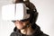 A close up of an unknown male wearing a VR headset and experiencing virtual reality. VR, virtual reality, gaming, e-sports concept