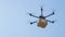 CLOSE UP Unmanned helicopter carries a brown package containing COVID-19 vaccine