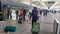 CLOSE UP: Unrecognizable female traveler walks towards her train leaving Lhasa.