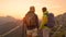 CLOSE UP: Unrecognizable hiker couple watching the sunset from the mountaintop.