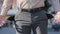 Close-up unrecognizable man turning empty pockets in male pants. Poor businessman has money problems finances crisis