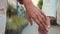 Close up unrecognizable wrinkled hand elderly old senior aged man and woman married couple husband wife holding hands