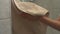 Close-up of unrecognizable young woman drying hands on towel in modern bathroom after washing arms with liquid soap