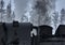 Close-up of the upper part of a steam locomotive emitting white hot steam and black smoke from coal firing