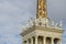 Close-up of upper part tower of Sochi Commercial Sea Port building with sculptures. Famous building is one of symbols of city reso