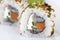 Close up of Uramaki with sardine and carrots. Traditional japanese sushi rolls